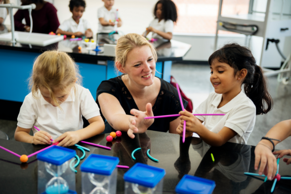 teacher with child learning