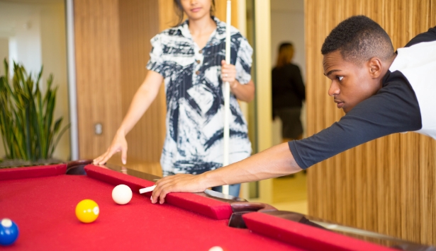 Teen playing a game of pool