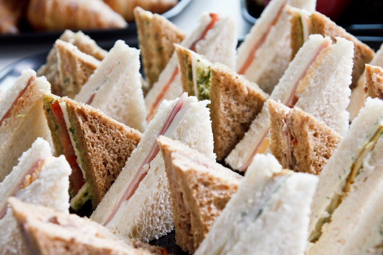 Cheese sandwich made with white bread on a board