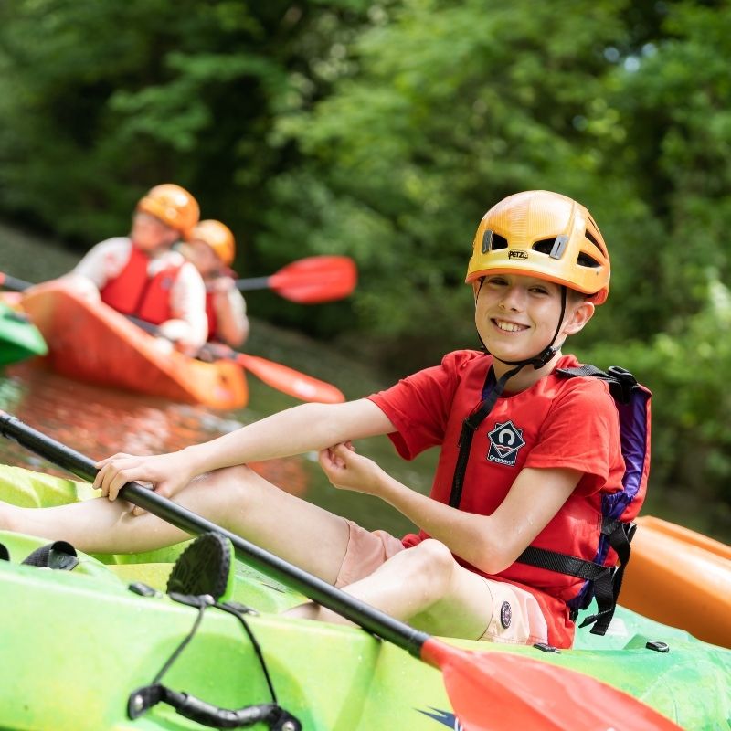 A young person in a kayak on Basingstoke Canal